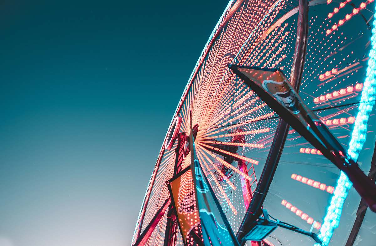 ferris wheel worm's eye view of a lit Ferris Wheel trails